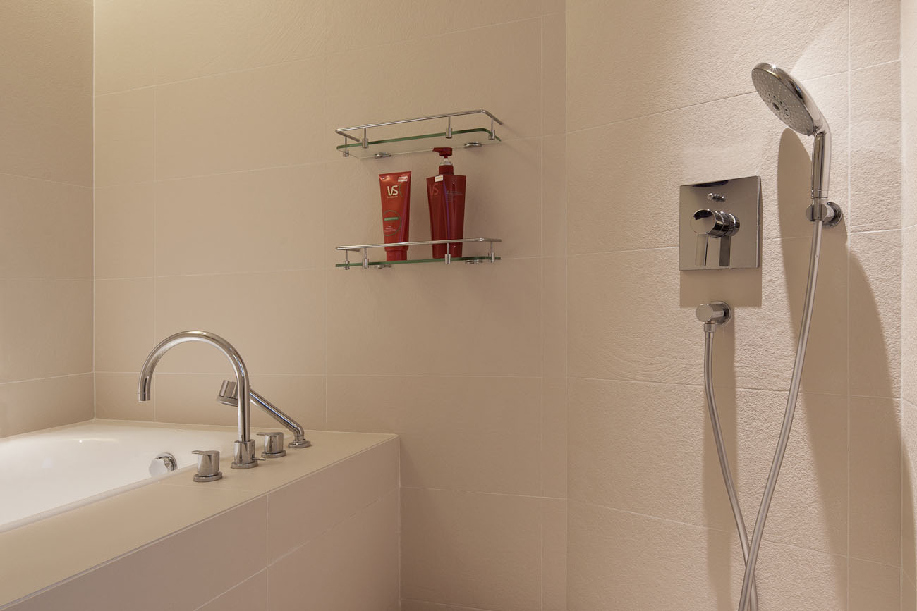 lui design associates designer interior apartment condo residential earth tones wood minimal hong kong china architecture sauna shower washroom bathroom