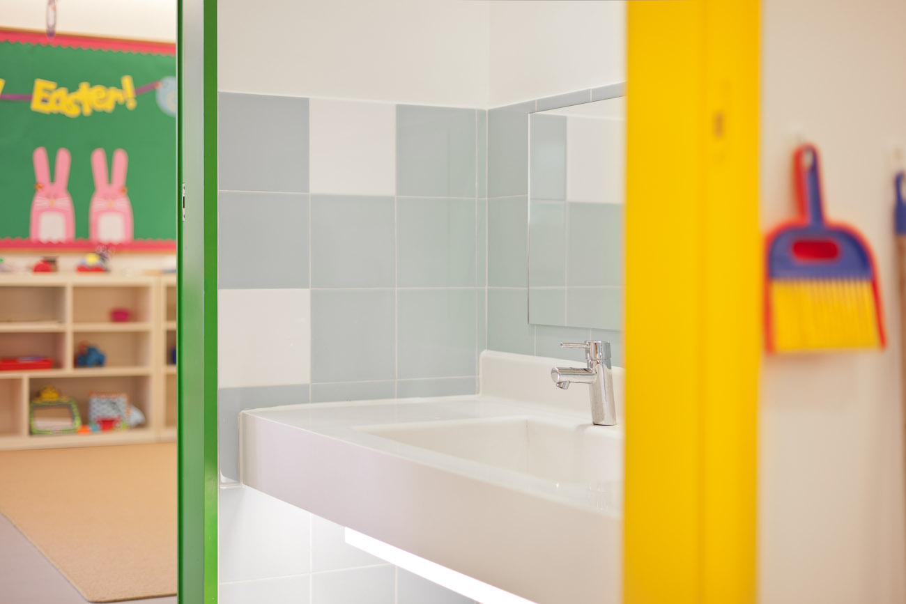 lui design and associates designers interior school kids education modern toilet minimal white architecture hong kong china central kindergarden wood toys